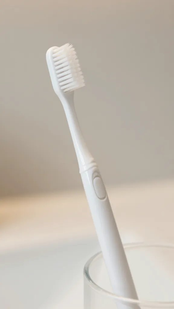 Closeup of one elegant toothbrush holder against a clean neutral vanity backdrop